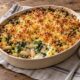 Leek, kale and butter bean gratin with golden Cheddar crumbs in a ceramic baking dish